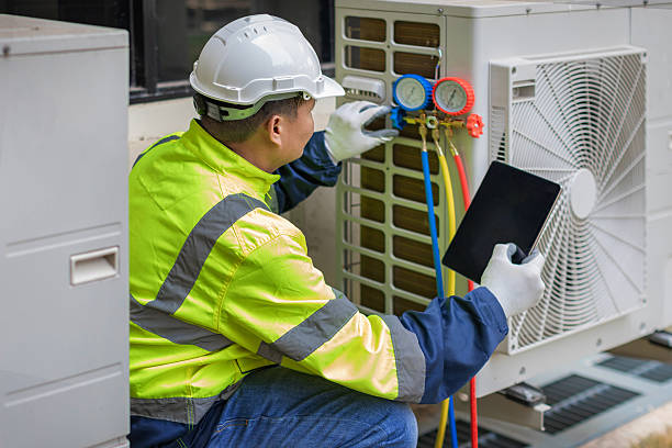 Professional Air Duct Cleaning technician working in Wellsville, OH